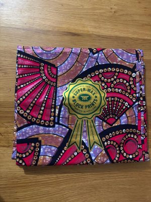 Grand Super Wax Hollandais multi couleurs paillettes cuivrées 100%. Longueur 5.486m (6 yards)/ largeur 1.17